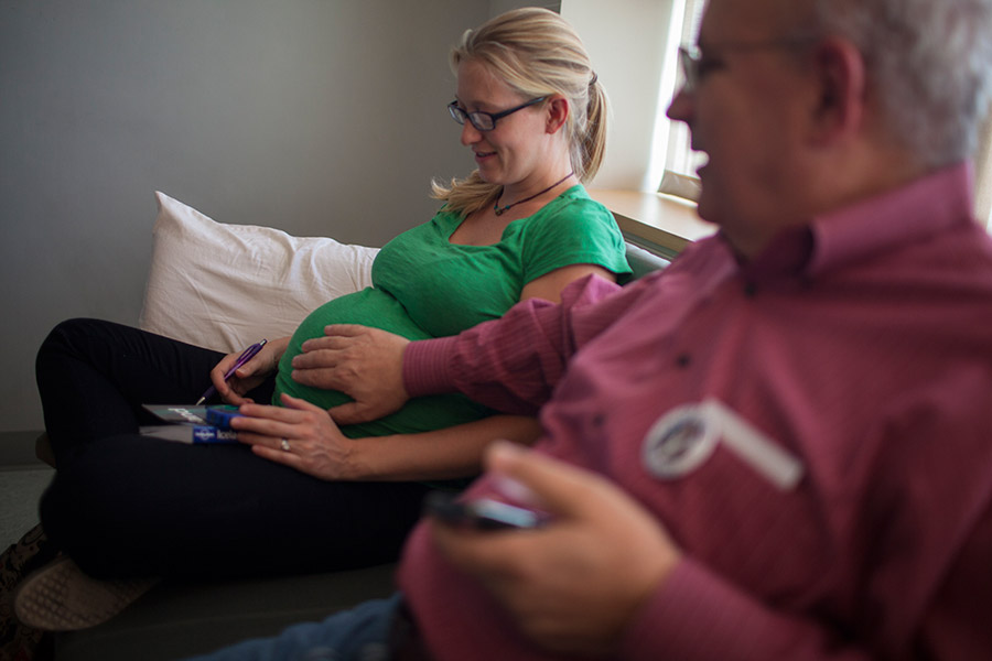 Family take turns visiting her in the hospital. Her daughter-in-law Erin is pregnant with Debbie's first grandchild, Maya.