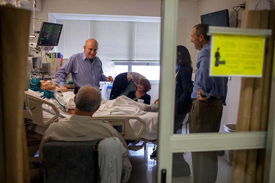 Ed holds court, livening things up in the hospital room.