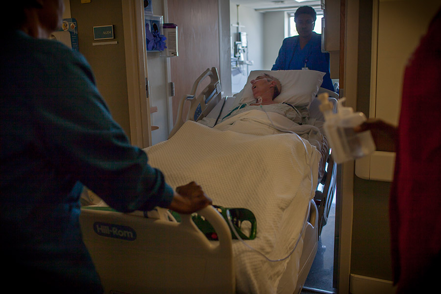 Debbie is wheeled into a hospice room at the hospital.